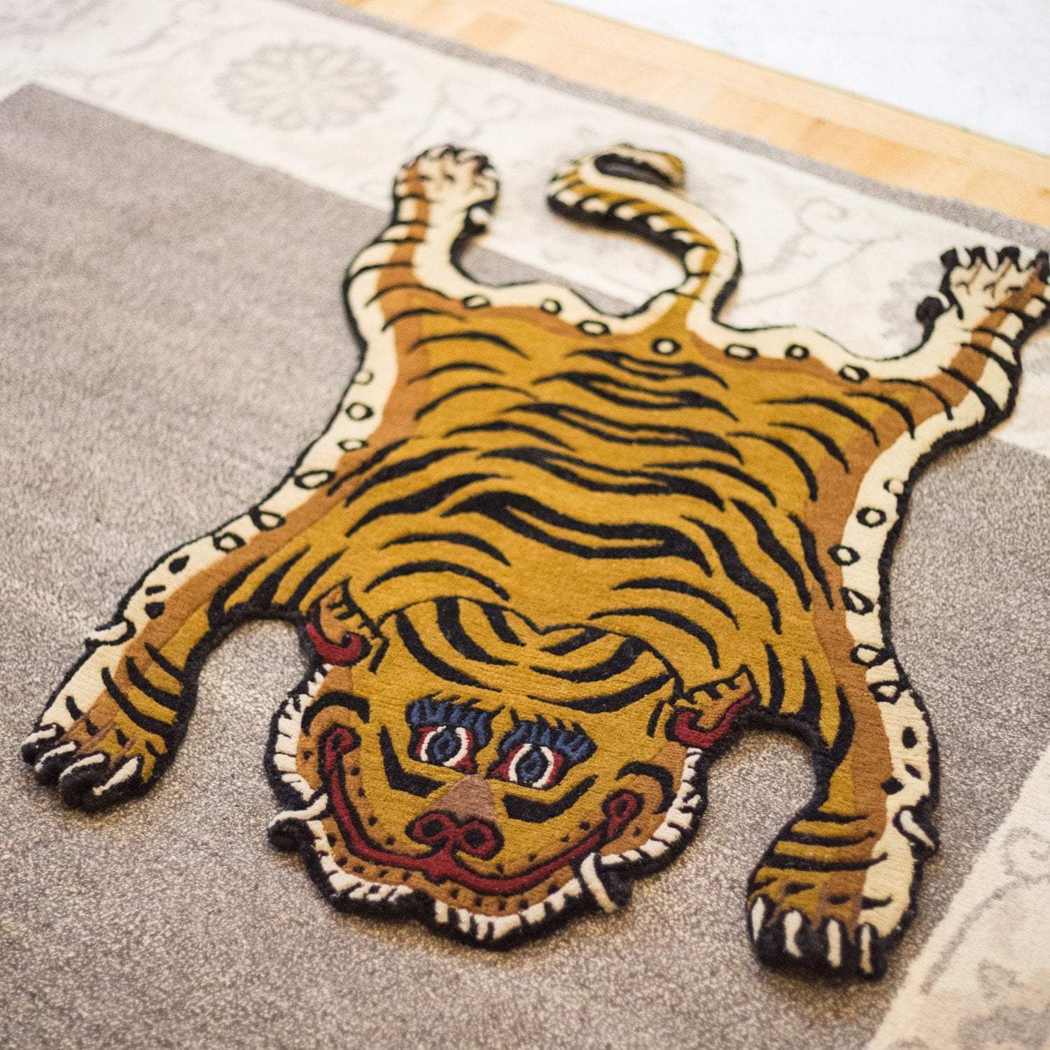 https://www.dharmashop.com/cdn/shop/products/carpets-tibetan-tiger-rug-11-cr060-6594921267246_1500x.jpg?v=1575932538