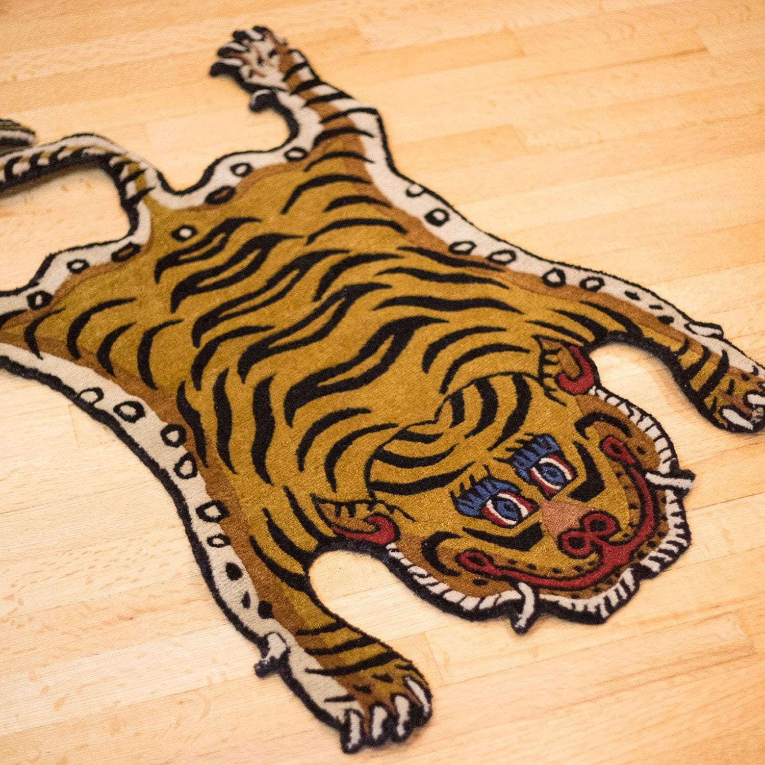 https://www.dharmashop.com/cdn/shop/products/carpets-tibetan-tiger-rug-12-cr087-6594919137326_1500x.jpg?v=1575932538