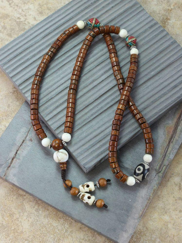 Cut Phoenix Eye Bodhi Seed Mala with Inlaid Spacers - DharmaShop